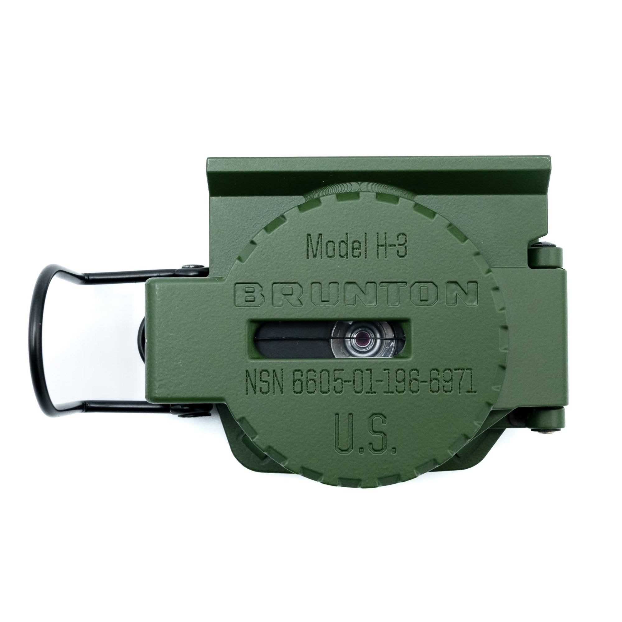 Green Brunton compass on a white background