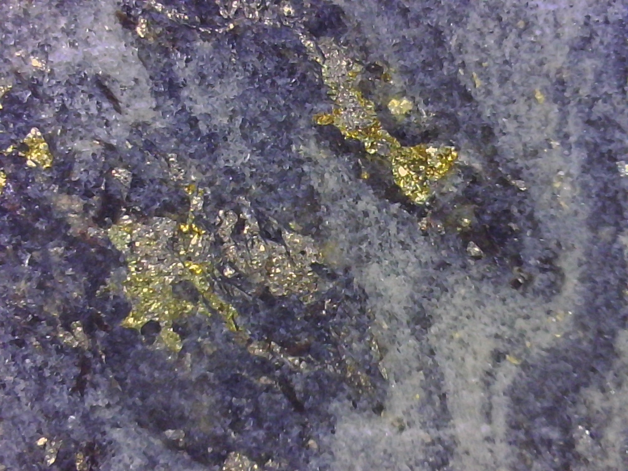 Close-up of a textured surface with yellow and gray colors