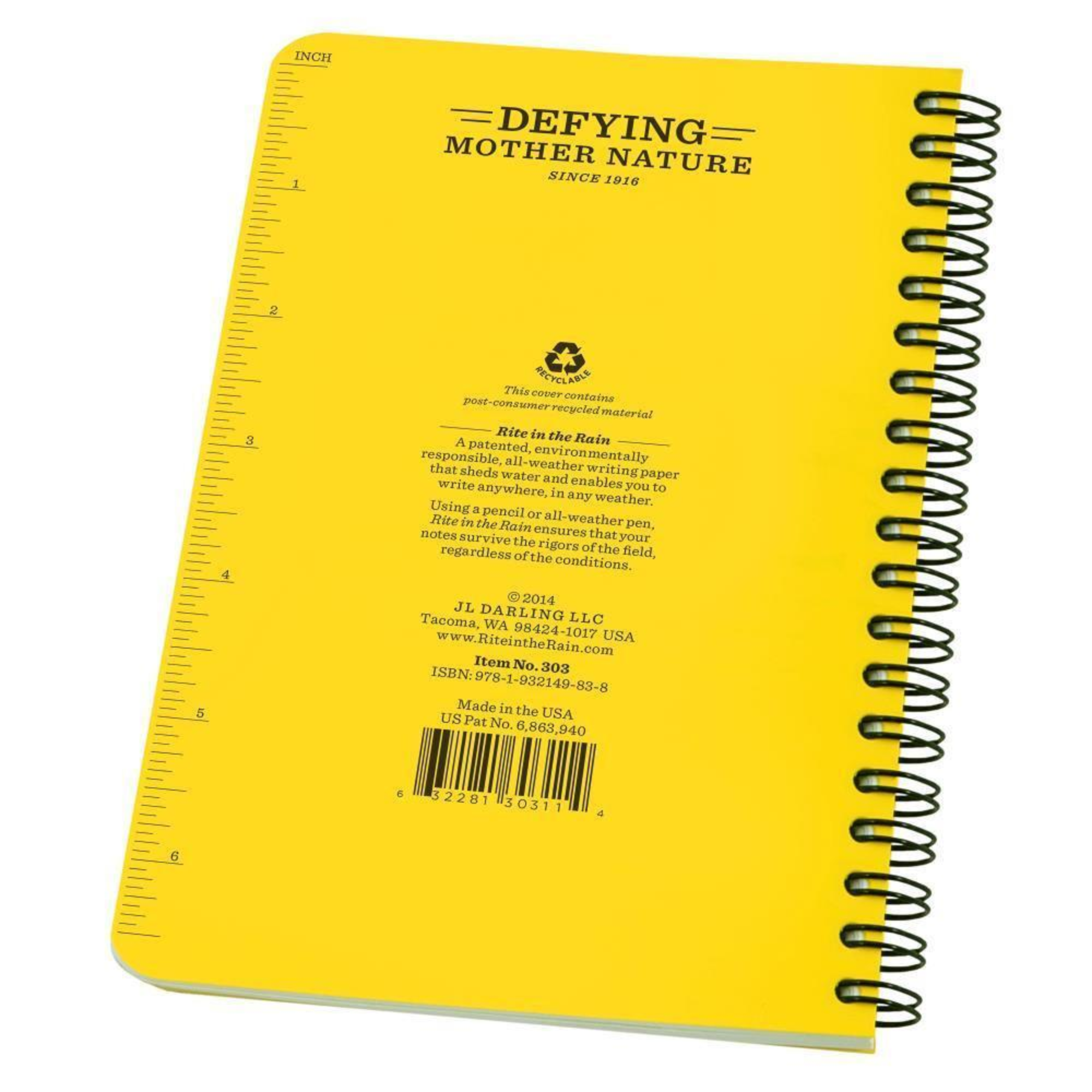 The back of a yellow side spiral notebook showing a measurement scale on the side