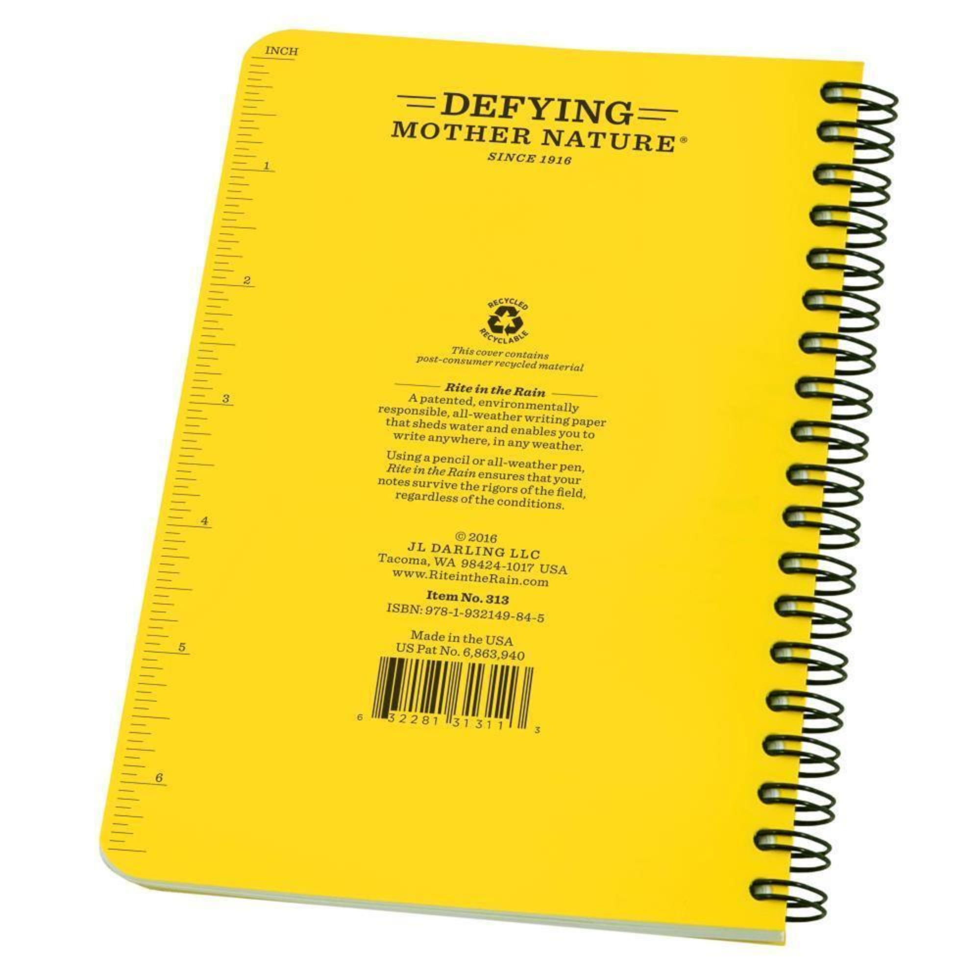 Back of a yellow side spiral notebook with a measurement scale on the side.