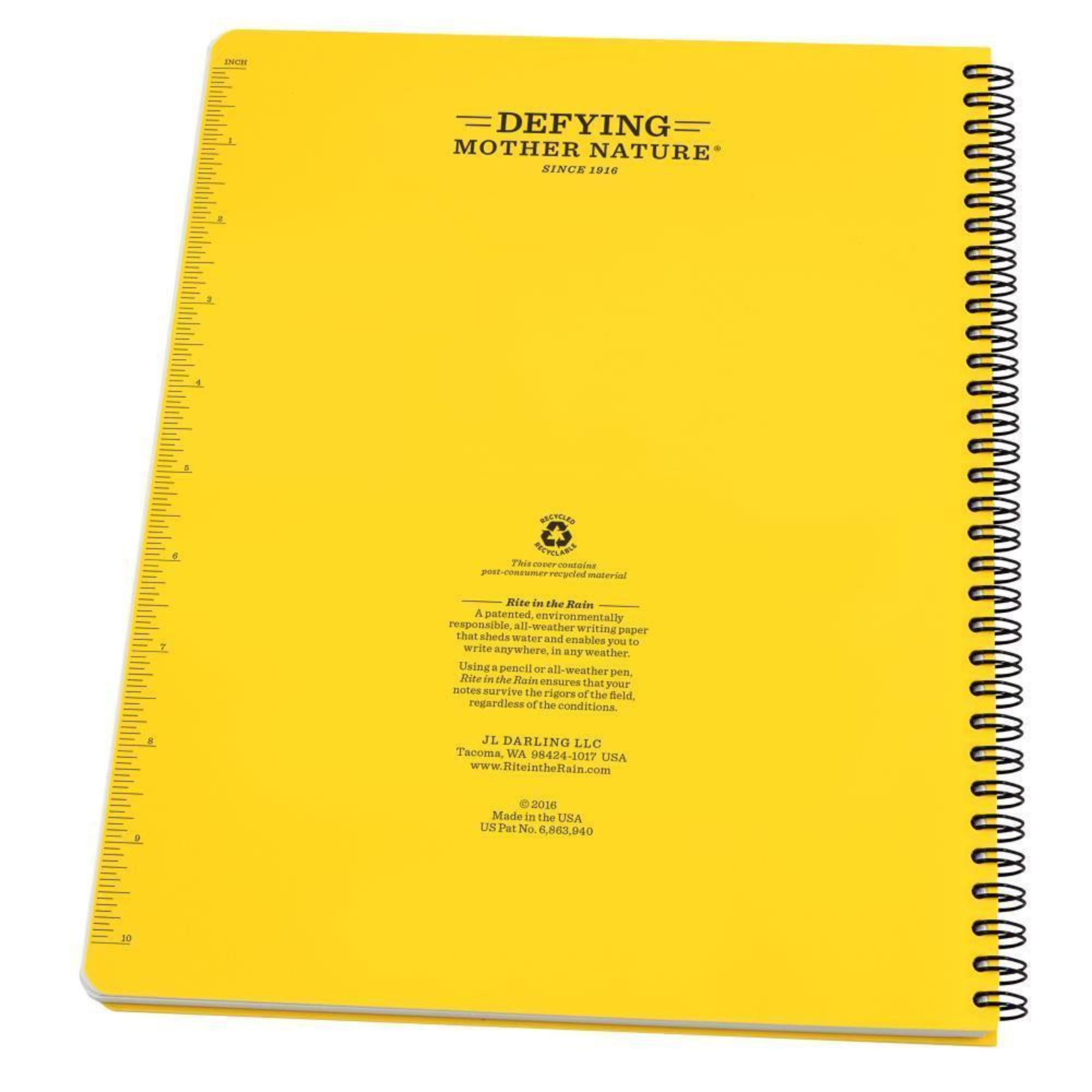 Back of a yellow notebook with a side spiral and measurement scale on the side.